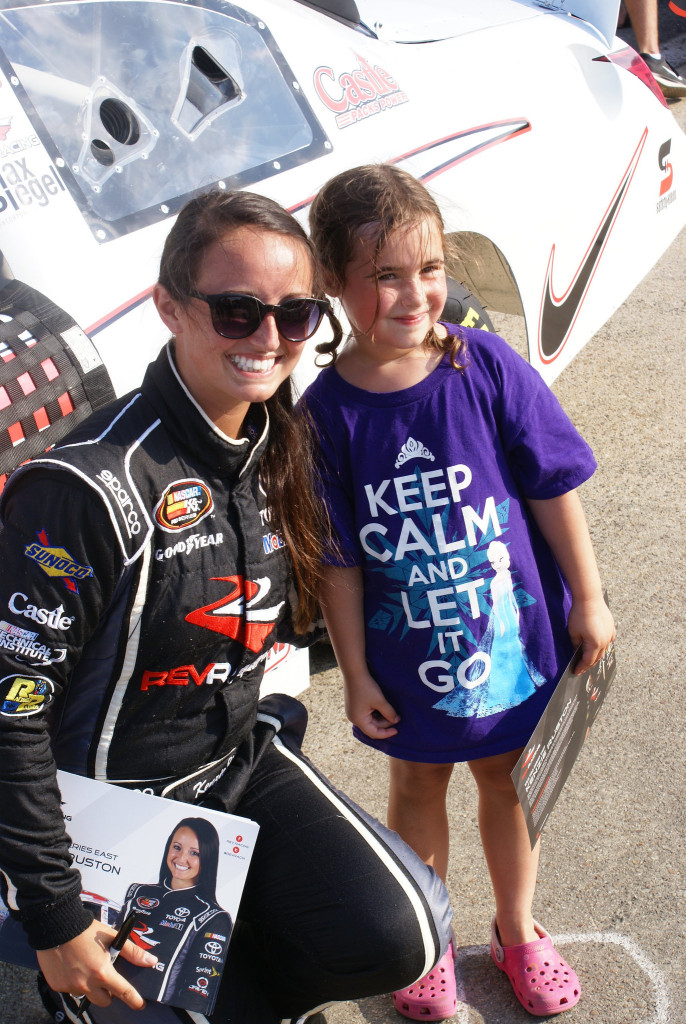 Kenzie poses for a picture with a young fan who won't forget her day at the race! (Photo Courtesy of Rev Racing)