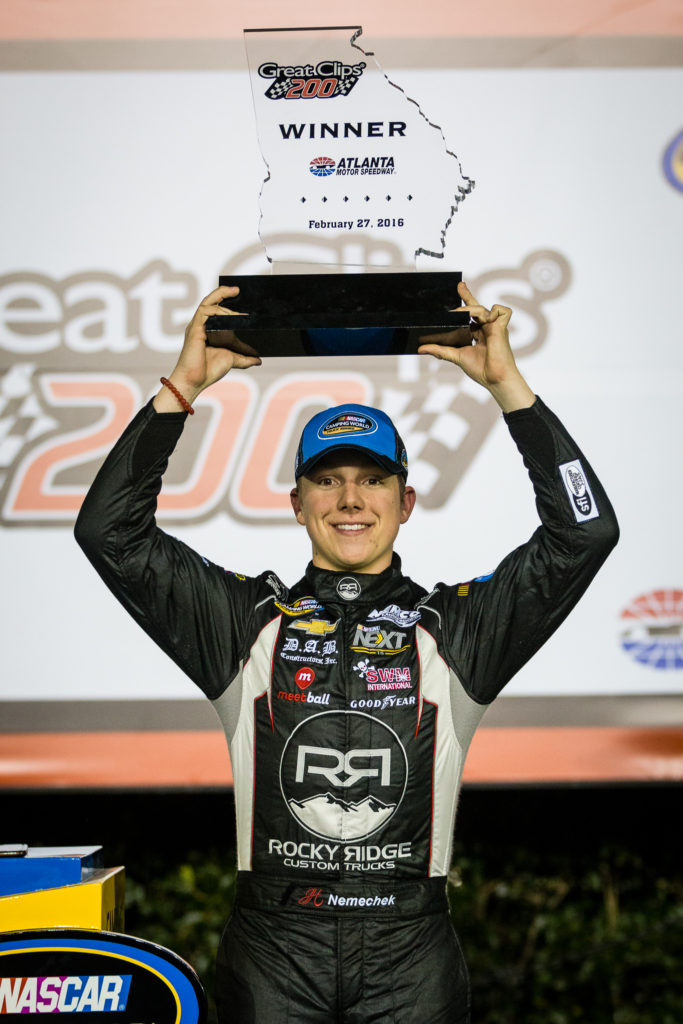 John Hunter Nemechek hoists the trophy after winning at Atlanta earlier this year. (Photo Credit: Barry Cantrell)