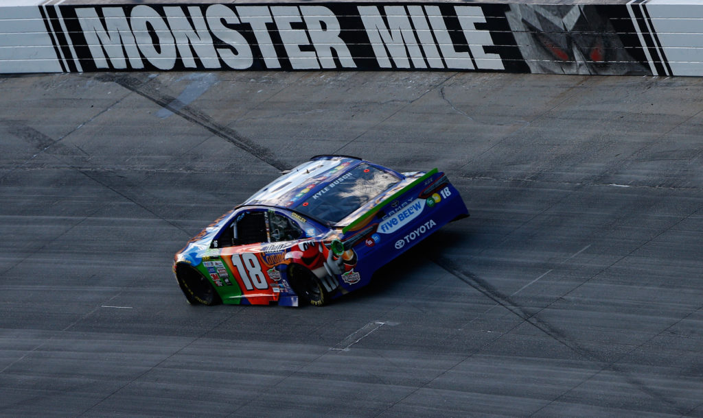 Kyle Busch used the high line to win at Dover.