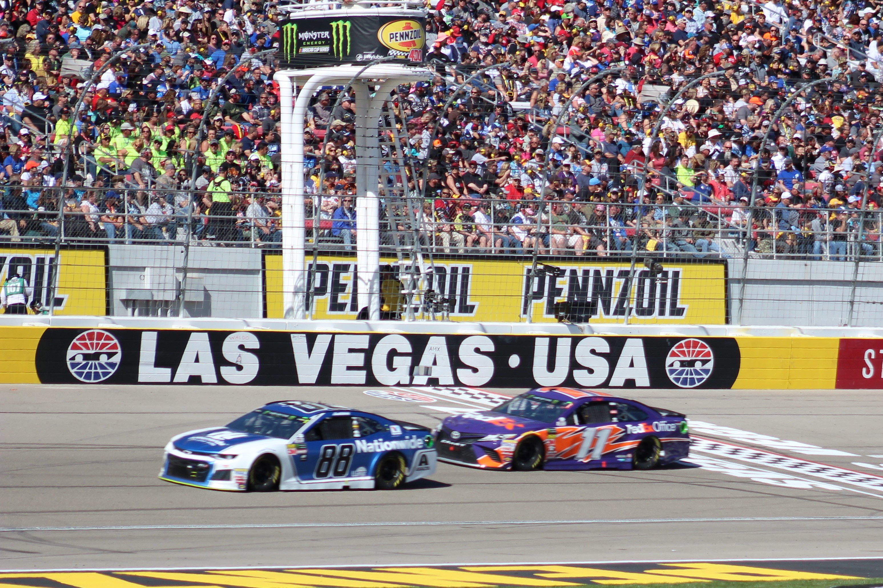 Bowman leads Denny Hamlin down the frontstretch at Las Vegas. (Photo Credit: Jose L. Acero Jr/TPF)