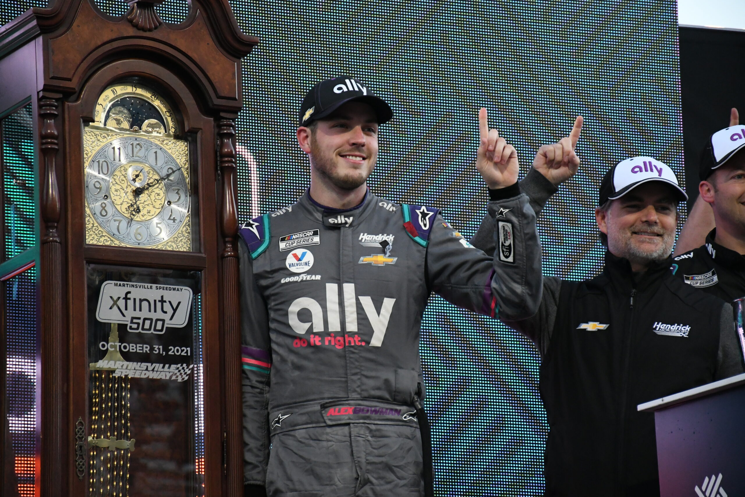 Four-time 2021 race winner Alex Bowman celebrates his latest triumph with four-time NASCAR Cup Series champion Jeff Gordon. (Photo: Michael Guariglia | The Podium Finish)