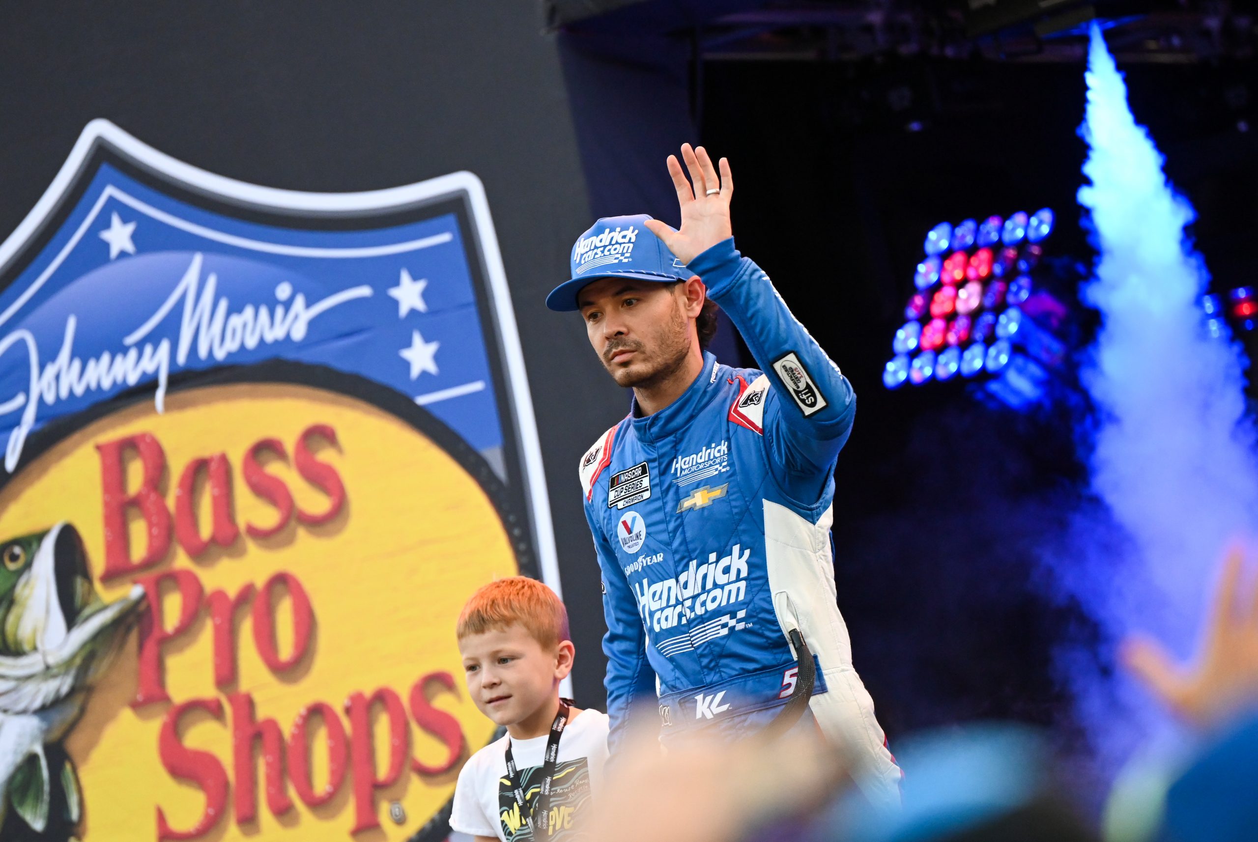 Kyle Larson and son Owen acknowledge the fans at Bristol Motor Speedway. (Photo: Kevin Ritchie | The Podium Finish)