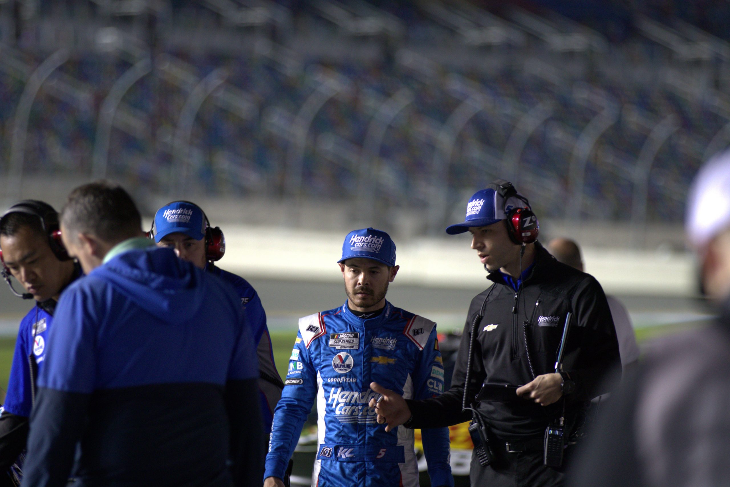 Kyle Larson and Cliff Daniels confer before Wednesday night's front row qualifying session. (Photo: Cornnell Chu | The Podium Finish)