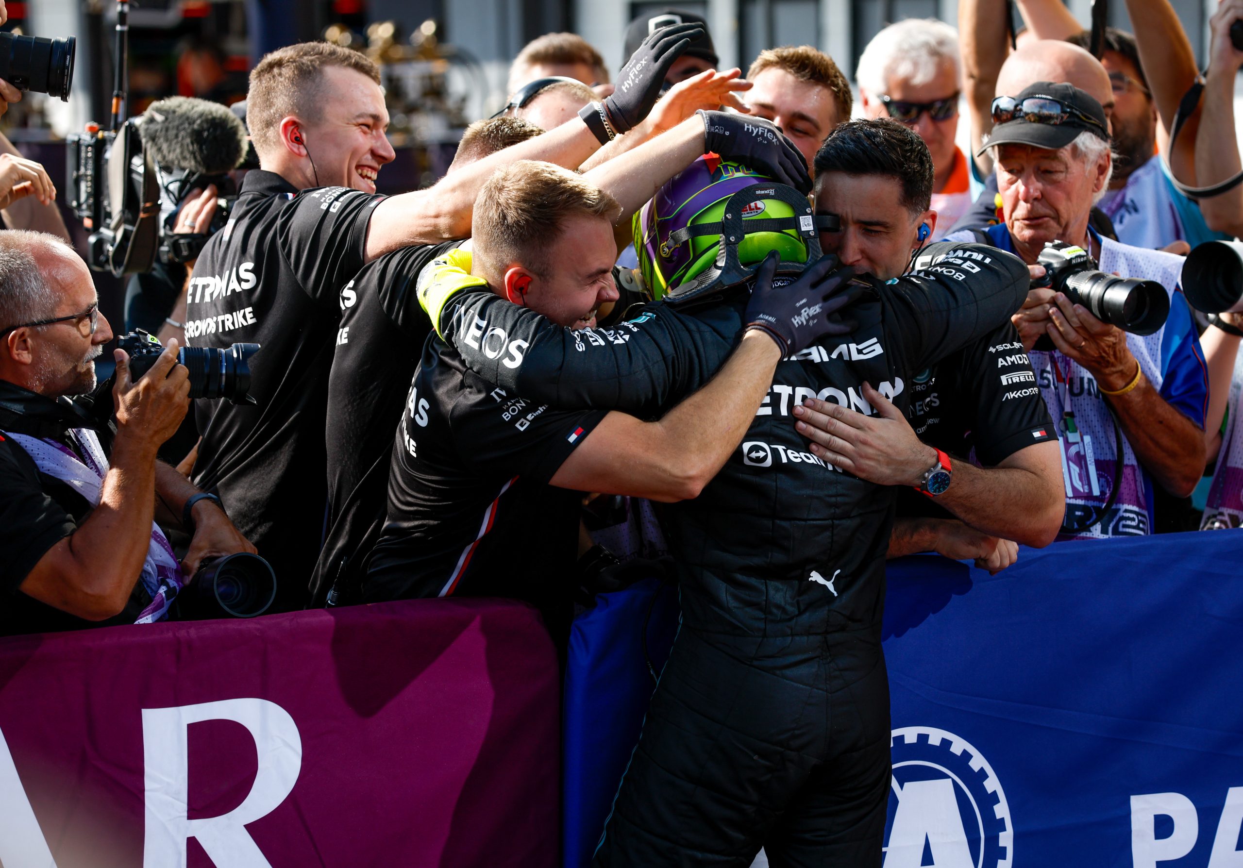 Lewis Hamilton (44) embraces his Mercedes team after capturing the pole at the Hungarian Grand Prix