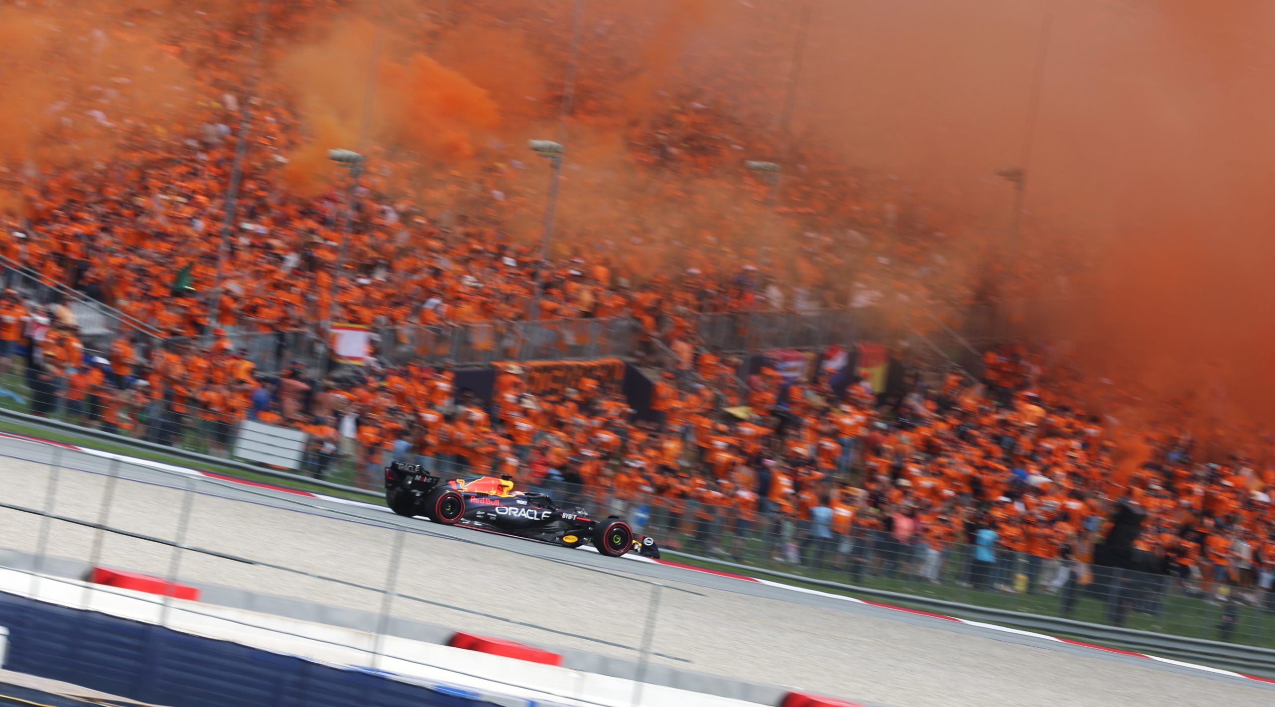 Max Verstappen (1) passes by the Red Bull Ring crowd in his Red Bull en route to his 5th win in a row in 2023.