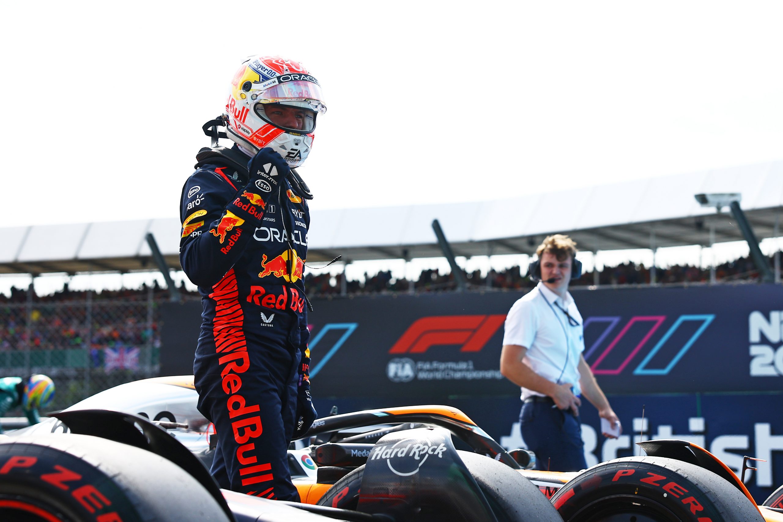 Max Verstappen (1) exits his Red Bull after taking the pole for the British Grand Prix ahead of Lando Norris (4) and Oscar Piastri (81)