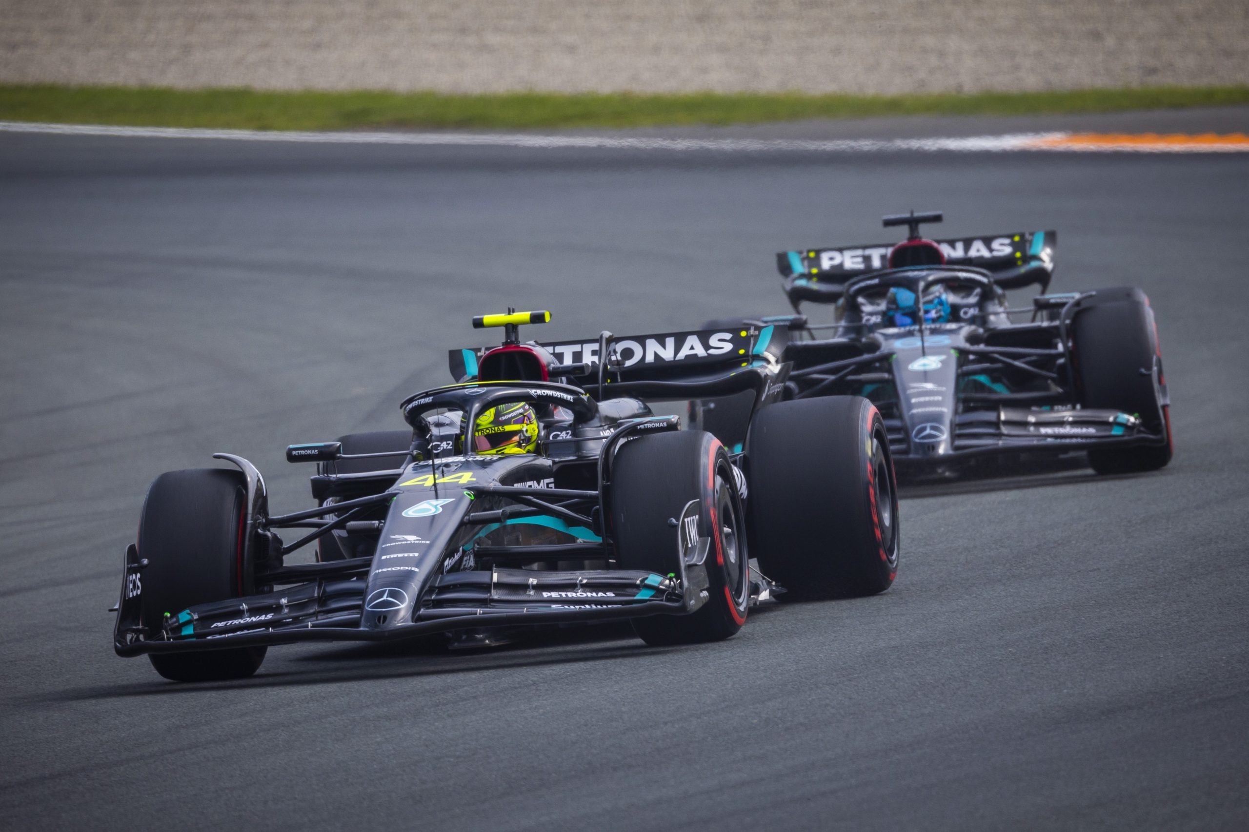 Lewis Hamilton (44) leads his Mercedes teammate George Russell (63) around the Circuit Zandvoort ahead of the Formula 1 Dutch Grand Prix