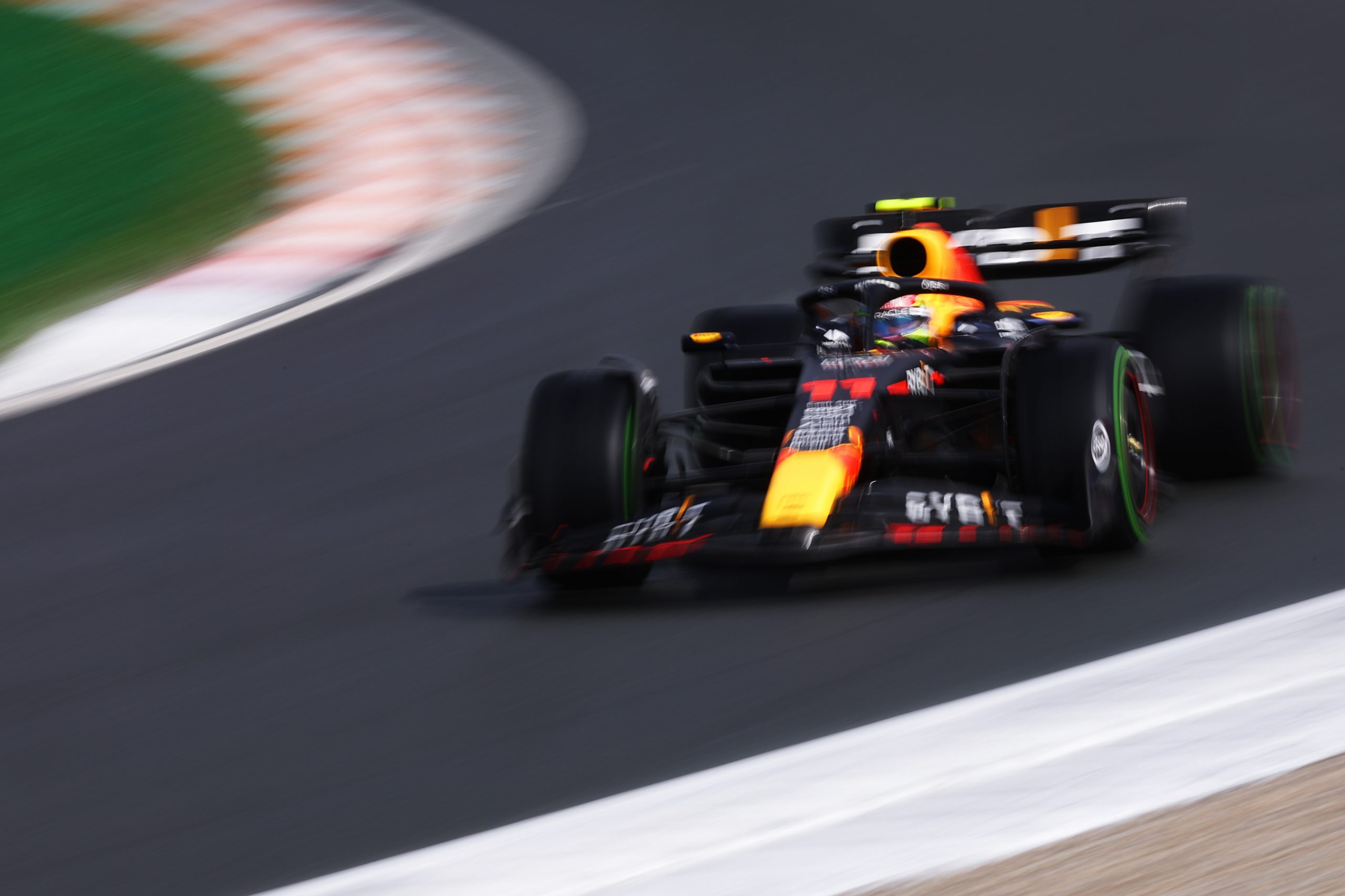 Sergio Perez (11) takes qualifying laps in his Red Bull at the Formula 1 Dutch Grand Prix
