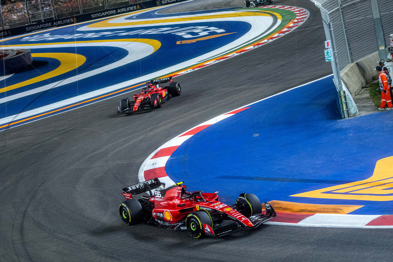 Carlos Sainz (55) leads Ferrari teammate Charles Leclerc (16) at the Marina Bay Circuit for the Formula 1 Singapore Grand Prix