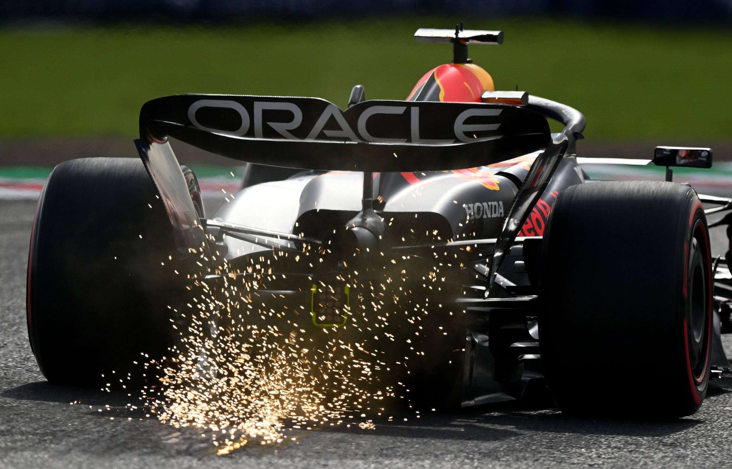 Sparks fly behind Max Verstappen of the Netherlands driving the (1) Oracle Red Bull Racing RB19 during qualifying ahead of the F1 Grand Prix of Japan at Suzuka International Racing Course
