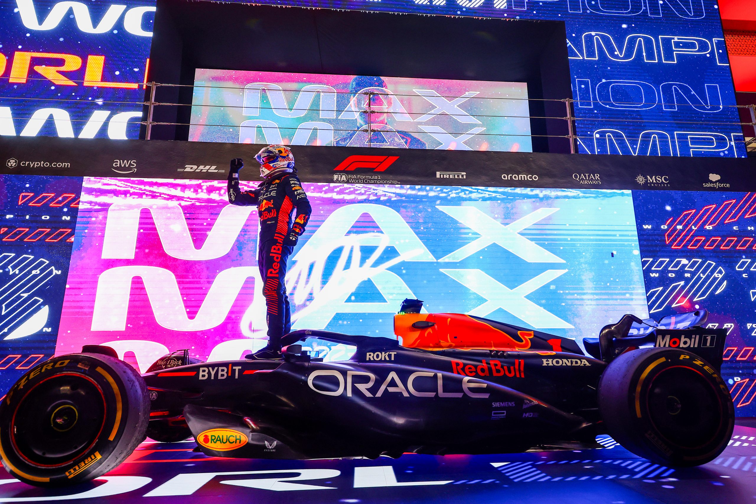2023 F1 World Drivers Champion Max Verstappen of the Netherlands and Oracle Red Bull Racing celebrates with Sprint winner Oscar Piastri of Australia and McLaren in parc ferme during the Sprint ahead of the F1 Grand Prix of Qatar at Lusail International Circuit on October 07, 2023 in Lusail City, Qatar. (Photo by Clive Rose/Getty Images)