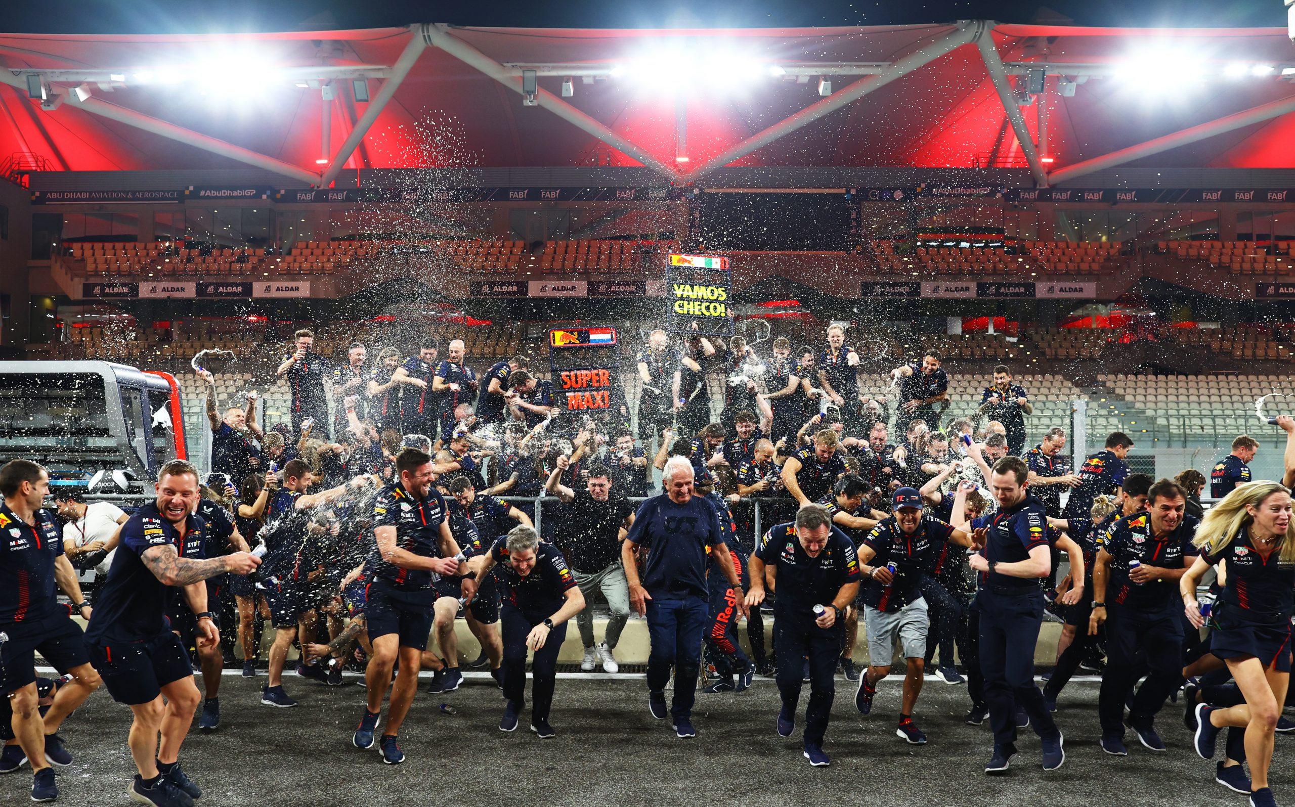 The Red Bull Racing team celebrate in the Pitlane after the F1 Grand Prix of Abu Dhabi at Yas Marina Circuit on November 26, 2023 in Abu Dhabi, United Arab Emirates. (Photo by Mark Thompson/Getty Images) 