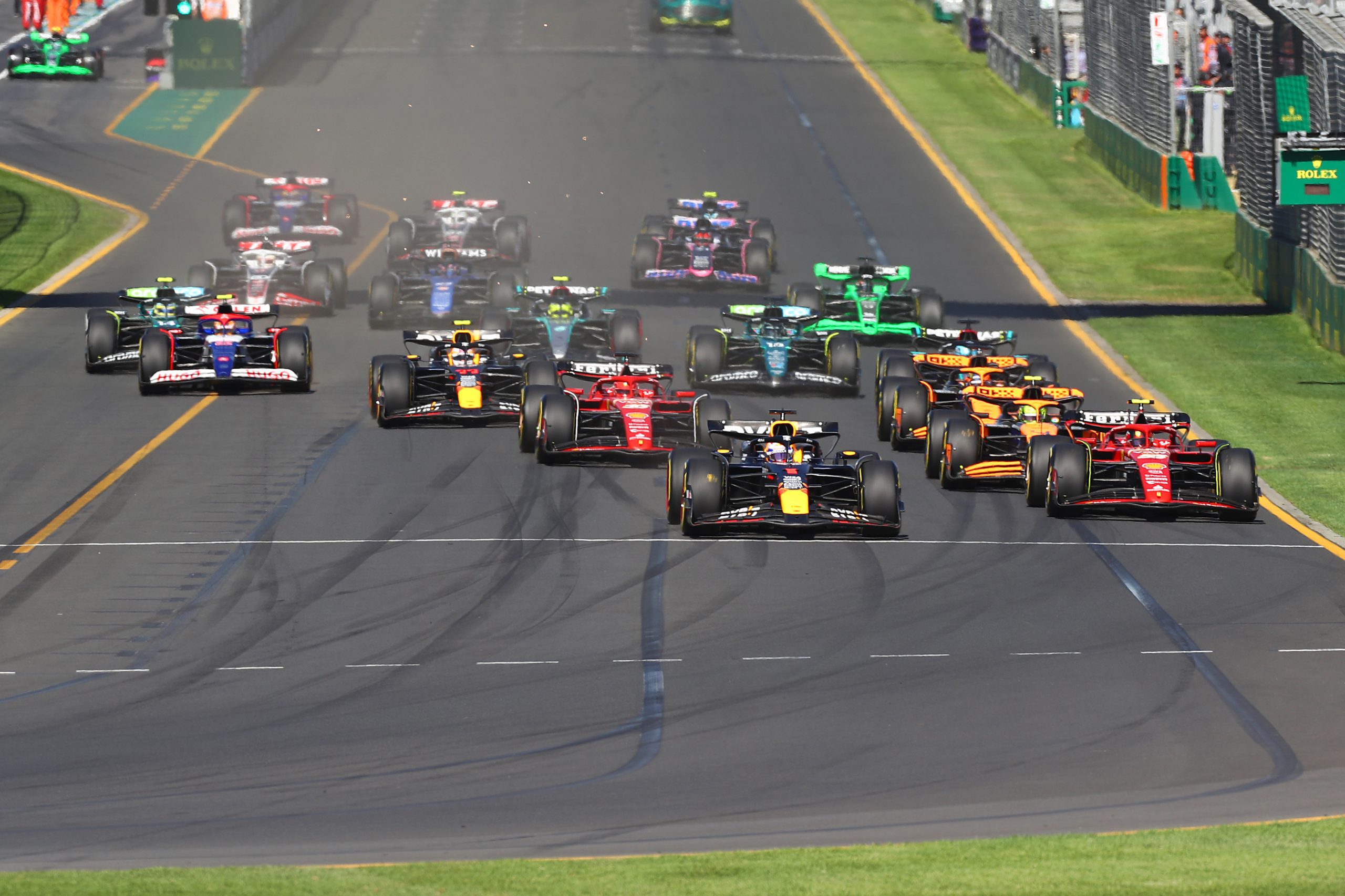 Max Verstappen of the Netherlands driving the (1) Oracle Red Bull Racing RB20 leads Carlos Sainz of Spain driving (55) the Ferrari SF-24 and the rest of the field into the first corner at the start of the race prior to the F1 Grand Prix of Australia at Albert Park Circuit on March 24, 2024 in Melbourne, Australia. (Photo by Peter Fox/Getty Images)