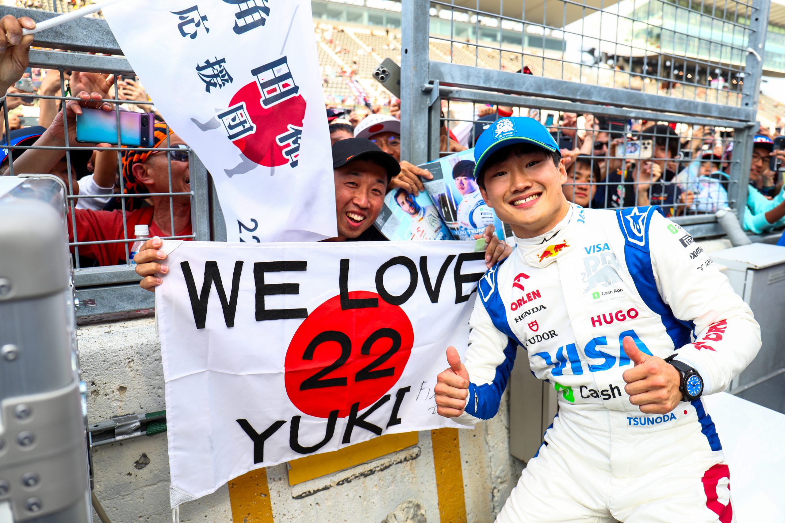Yuki Tsunoda of Scuderia Visa Cash App RB celebrates finishing in 10th position with the fans during the F1 Grand Prix of Japan at Suzuka International Racing Course on April 07, 2024 in Suzuka, Japan. (Photo by Peter Fox/Getty Images) (Photo by Peter Fox/Getty Images)