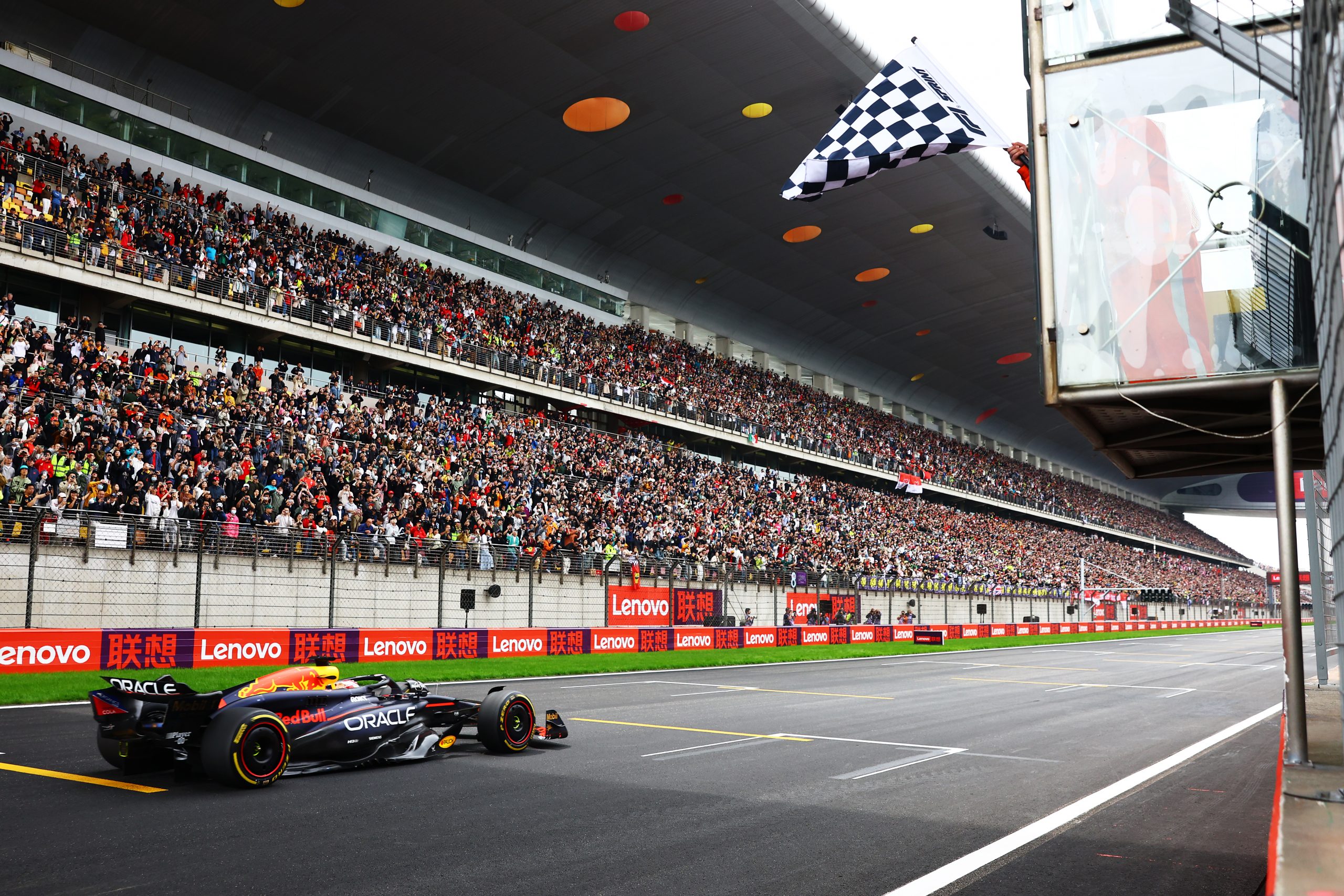 Sprint winner Max Verstappen of the Netherlands and Oracle Red Bull Racing takes the chequered flag during the Sprint ahead of the F1 Grand Prix of China at Shanghai International Circuit on April 20, 2024 in Shanghai, China. (Photo by Mark Thompson/Getty Images)
