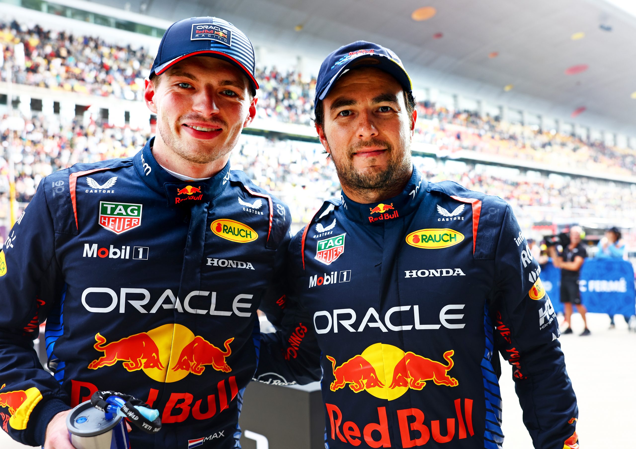 Pole position qualifier Max Verstappen of the Netherlands and Oracle Red Bull Racing and Second placed qualifier Sergio Perez of Mexico and Oracle Red Bull Racing celebrate in parc ferme after qualifying ahead of the F1 Grand Prix of China at Shanghai International Circuit on April 20, 2024 in Shanghai, China. (Photo by Mark Thompson/Getty Images)
