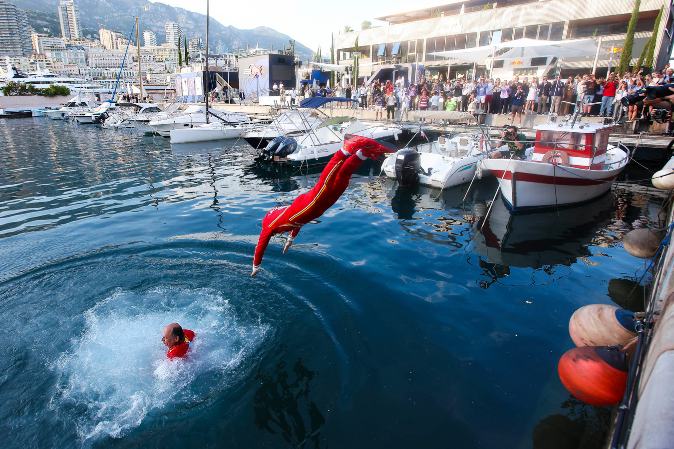 Charles Leclerc (16) dives into the bay in Monte Carlo along with Team Principal Fred Vasseur after winning the 2024 Formula 1 Monaco Grand Prix (Source: Scuderia Ferrari)