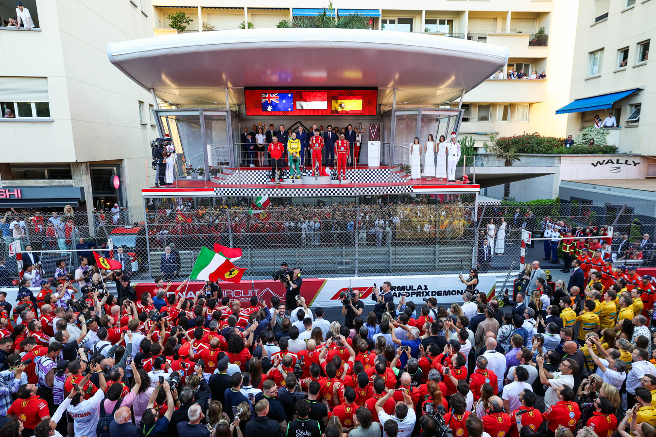 Race winner Charles Leclerc (16) stands up the top of the Monaco Grand Prix podium along with McLaren driver Oscar Piastri (81) and Ferrari teammate Carlos Sainz (55) following the 2024 Formula 1 Monaco Grand Prix (Source: Scuderia Ferrari)