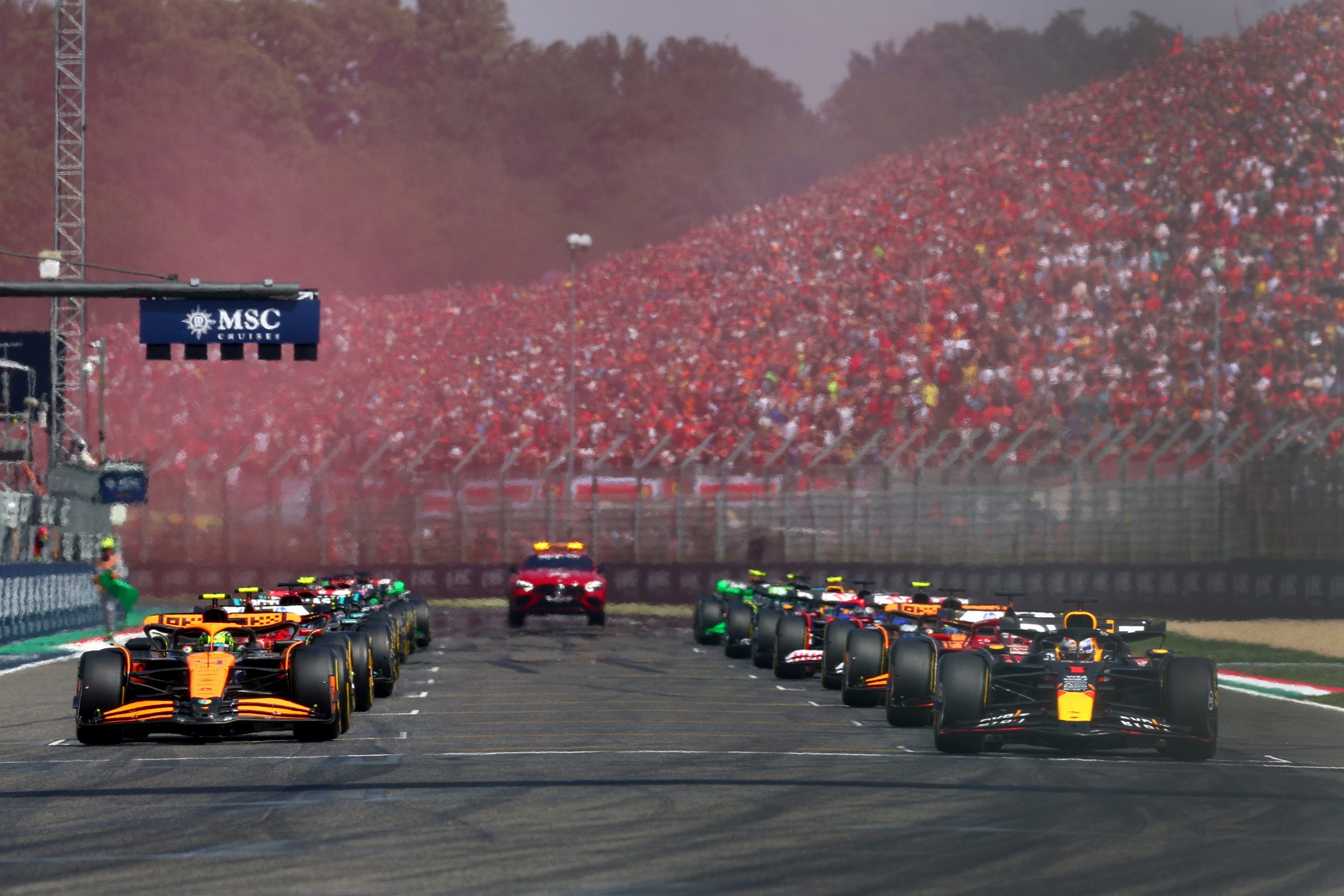 Max Verstappen of the Netherlands driving the (1) Oracle Red Bull Racing RB20 and Lando Norris of Great Britain driving the (4) McLaren MCL38 Mercedes line up on the front row of the grid for the start during the F1 Grand Prix of Emilia-Romagna at Autodromo Enzo e Dino Ferrari Circuit on May 19, 2024 in Imola, Italy. (Photo by Clive Rose/Getty Images)