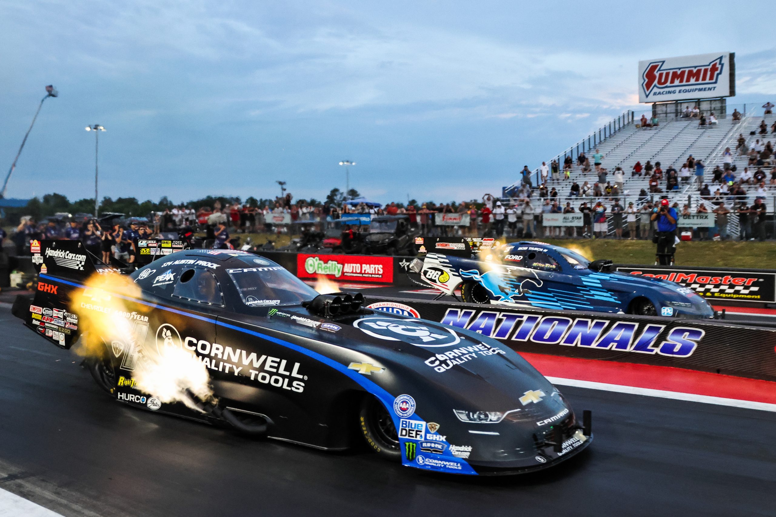 Austin Prock lines up against Bob Tasca in the final round of Funny Car eliminations.