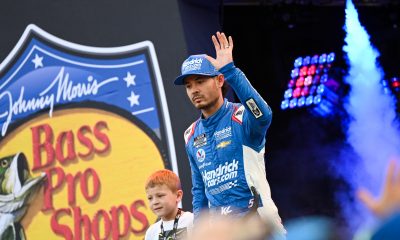 Kyle Larson and son Owen acknowledge the fans at Bristol Motor Speedway. (Photo: Kevin Ritchie | The Podium Finish)