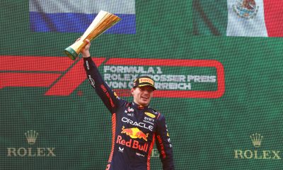 Red Bull Racing Driver Max Verstappen (1) lifts trophy on the podium at the Red Bull Ring after winning the Austrian Grand Prix