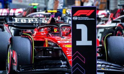 Carlos Sainz (55) parks at the #1 pit board after securing the pole position for Ferrari at the Marina Bay Street Circuit for the Formula 1 Singapore Grand Prix