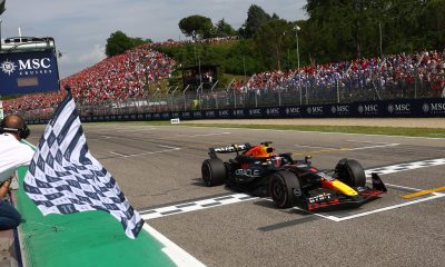 Race winner Max Verstappen of the Netherlands driving the (1) Oracle Red Bull Racing RB20 takes the chequered flag during the F1 Grand Prix of Emilia-Romagna at Autodromo Enzo e Dino Ferrari Circuit on May 19, 2024 in Imola, Italy. (Photo by Clive Rose/Getty Images)