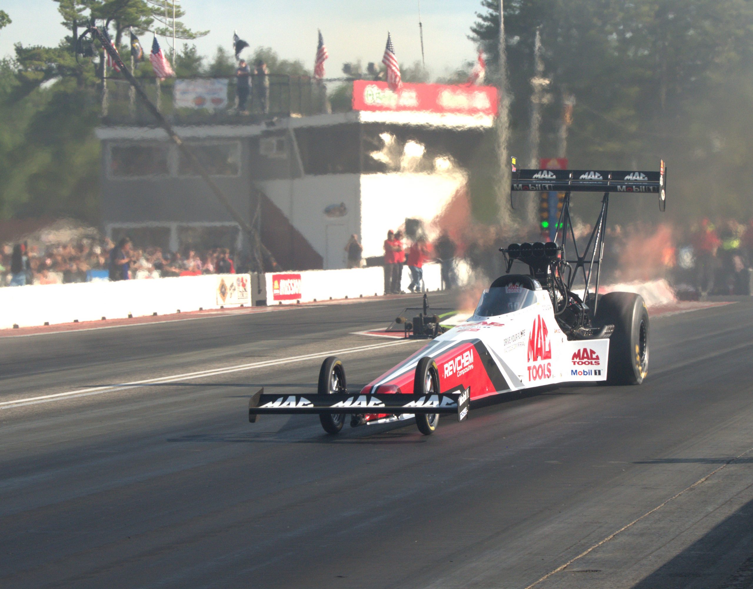 Doug Kalitta blasts his Mac Tools Top Fuel dragster down the track at New England Dragway