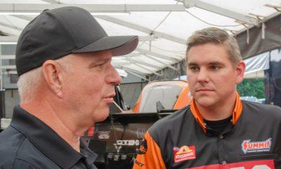 Tim and Dan Wilkerson compare notes during the NHRA New England Nationals at Epping, New Hampshire.