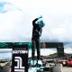 George Russell (63) stands above his Mercedes F1 W15 after claiming pole position at the Silverstone Circuit for the 2024 Formula 1 British Grand Prix (Source: Mercedes AMG)