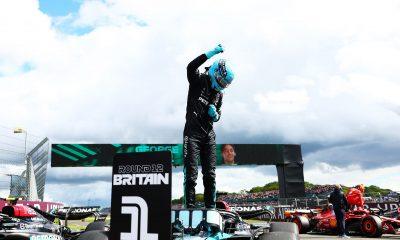 George Russell (63) stands above his Mercedes F1 W15 after claiming pole position at the Silverstone Circuit for the 2024 Formula 1 British Grand Prix (Source: Mercedes AMG)