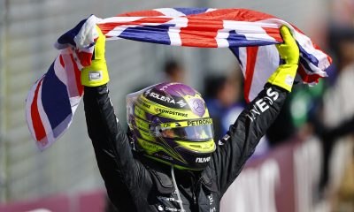 Lewis Hamilton (44) raises the Union Jack in a salute to the Silverstone Circuit fans after claiming victory in the 2024 Formula 1 British Grand Prix (Source: Mercedes AMG)
