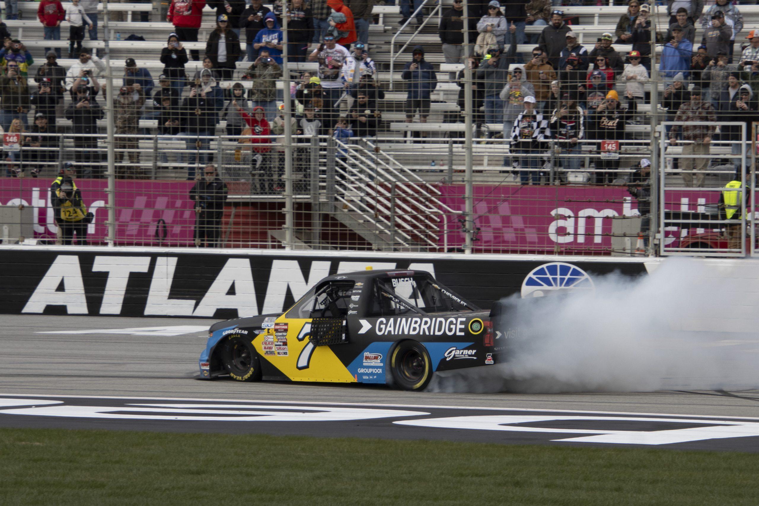 Kyle Busch celebrates his 67th win in the NASCAR CRAFTSMAN Truck Series with a burnout on the frontstretch at Atlanta Motor Speedway. (Photo Credit: Sydney Redden | The Podium Finish)