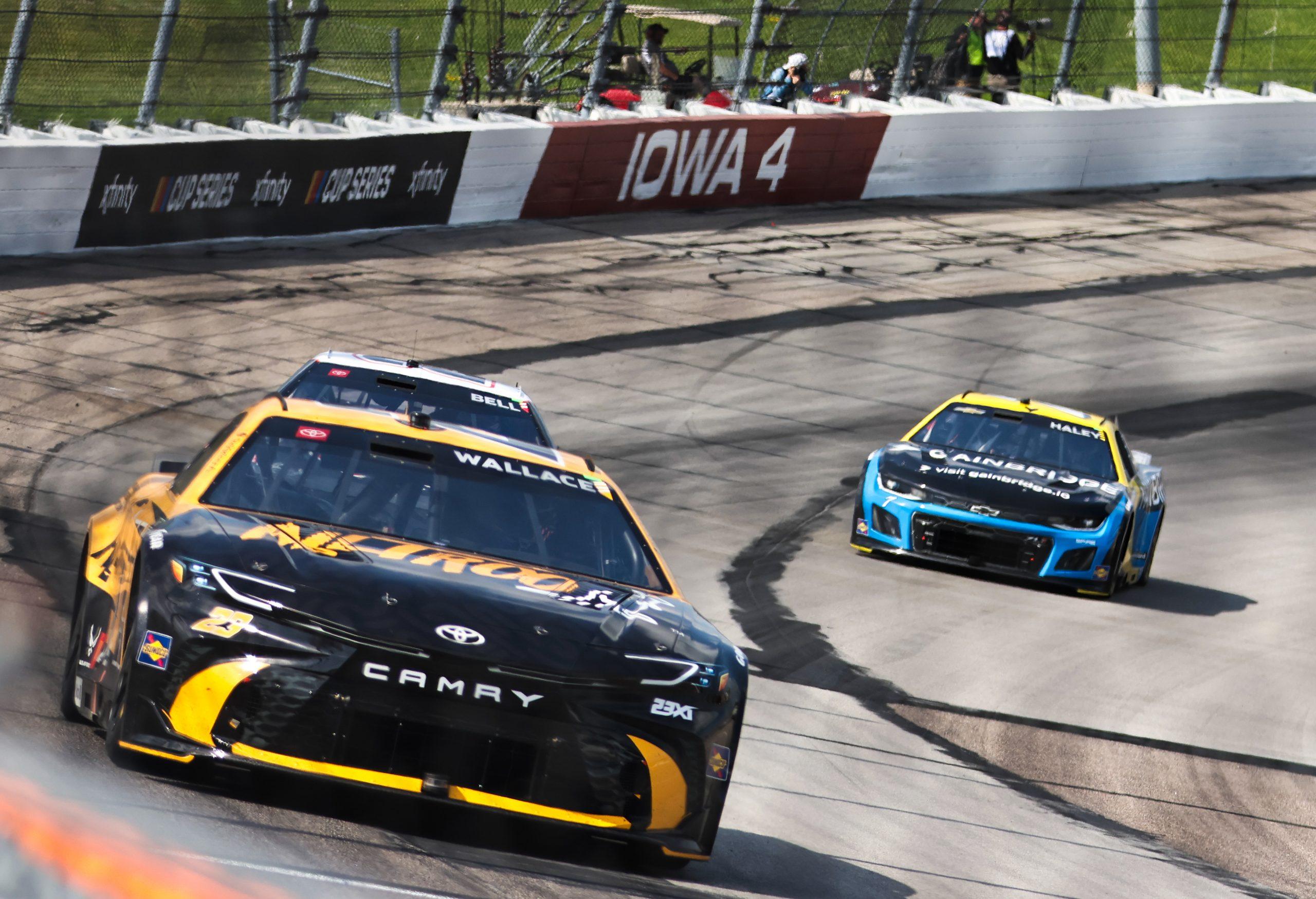 Bubba Wallace (front) heads out of Turn 4 at Iowa Speedway during the Iowa Corn 350.