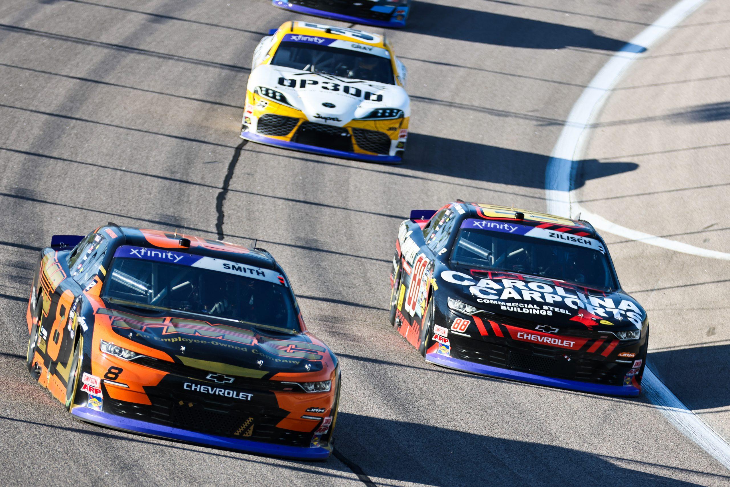 Sammy Smith (left) battles with teammate Connor Zilisch (right) for position at Kansas Speedway during the Kansas Lottery 300.