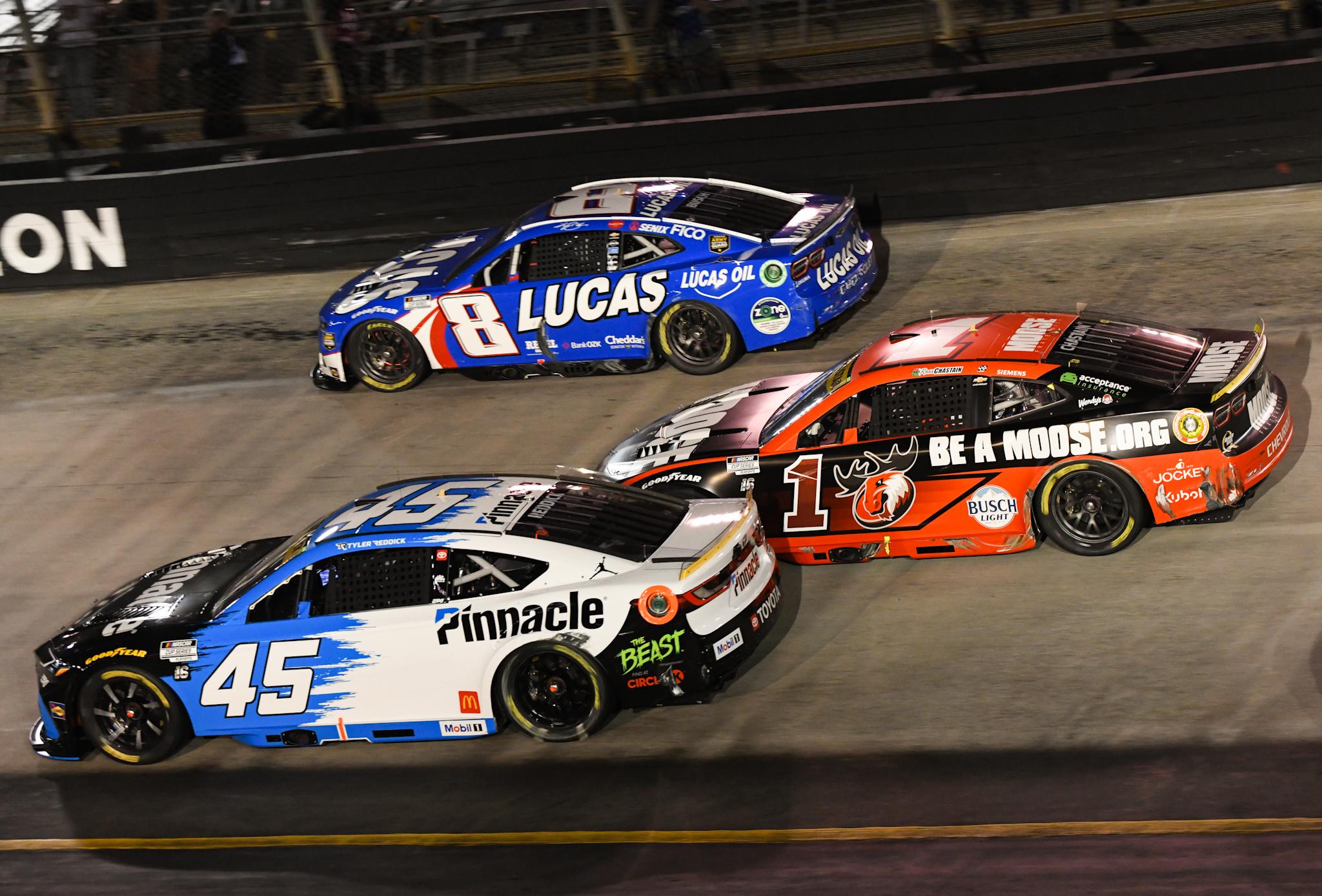 Tyler Reddick (bottom) battles three wide with Ross Chastain (middle) and Kyle Busch (top) during the Bass Pro Shops Night Race from Bristol Motor Speedway on Sept. 13th.