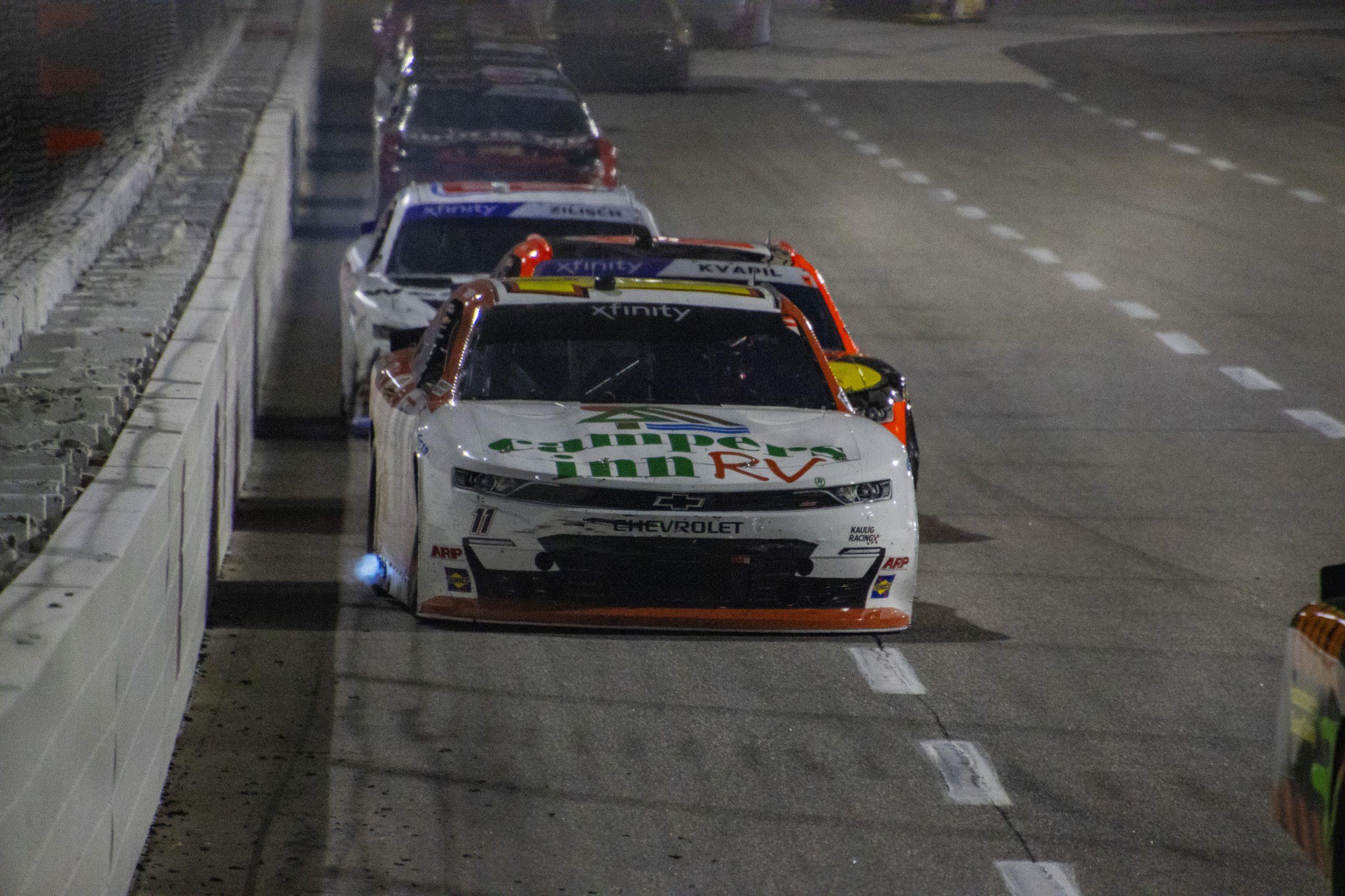 Carson Kvapil (back) battles with Brenden Queen (front) for position during the IAA and Ritchie Bros. 250 from Martinsville Speedway.