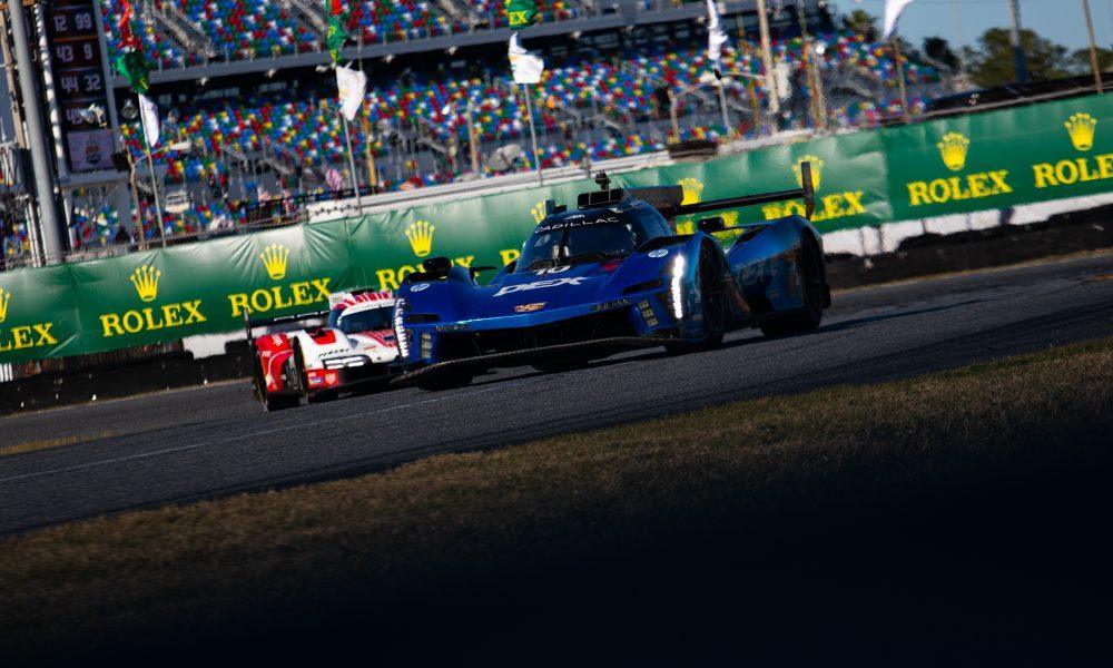 The No. 10 Wayne Taylor Racing Cadillac battling with the No. 6 Porsche during the Rolex 24 at Daytona. )