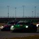AO Racing's No. 77 "Rexy" Porsche battling with Winward Racing in the late stages of the Rolex 24 at Daytona (Photo: Tyson Gifford | The Podium Finish)