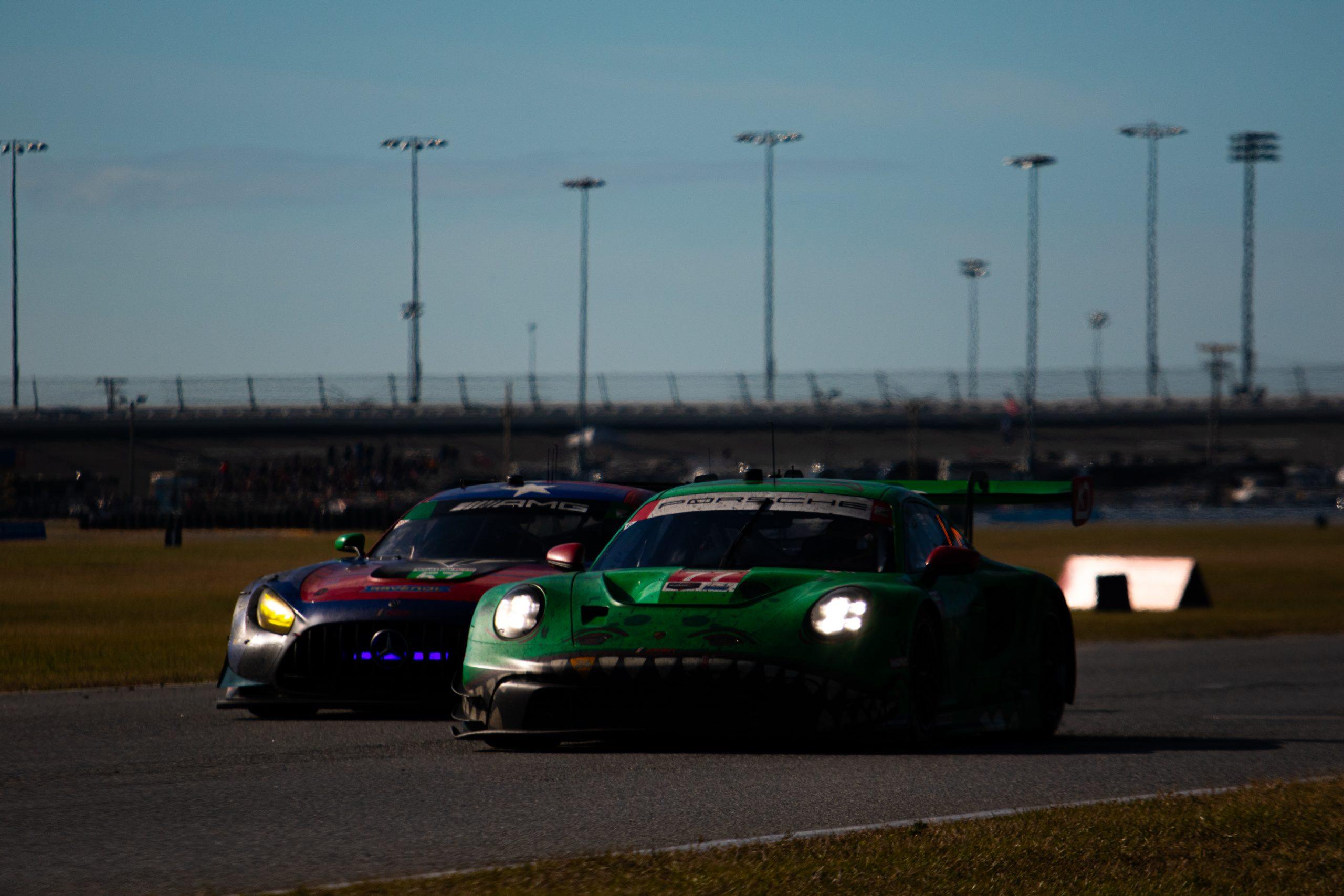 AO Racing's No. 77 "Rexy" Porsche battling with Winward Racing in the late stages of the Rolex 24 at Daytona (Photo: Tyson Gifford | The Podium Finish)