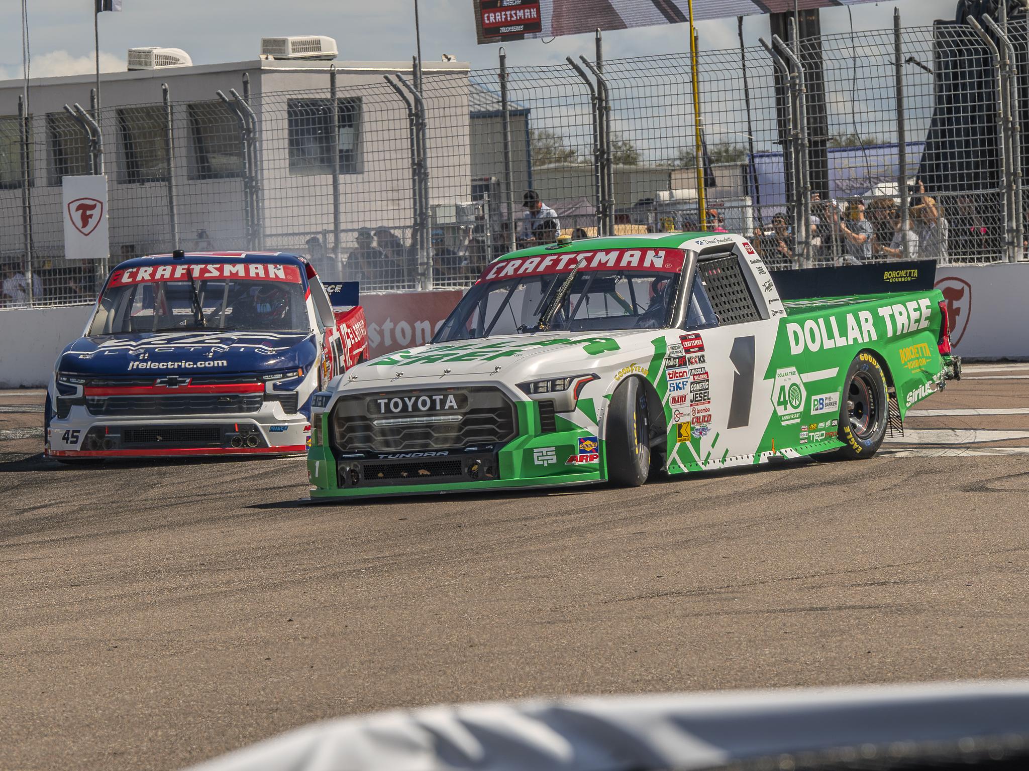 Dario Franchitti (front) slides through Turn 1 at the St. Petersburg Street Course during the OnlyBulls Green Flag 150.