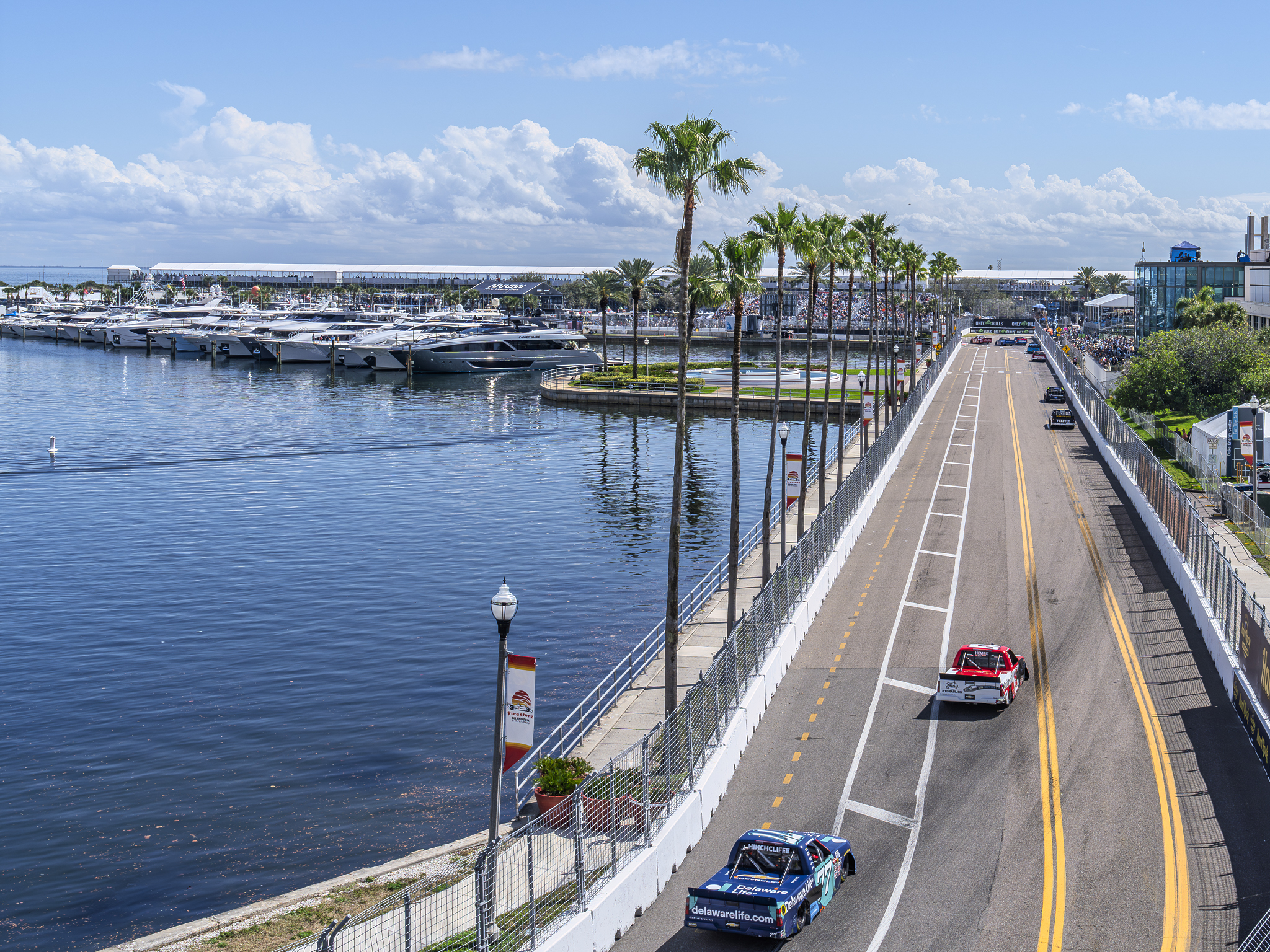 James Hinchcliffe (back) comes out of Turn 9 and heads down Dan Wheldon Way behind Daniel Hemric (front) during the OnlyBulls Green Flag 150 from the St. Petersburg Street Course.