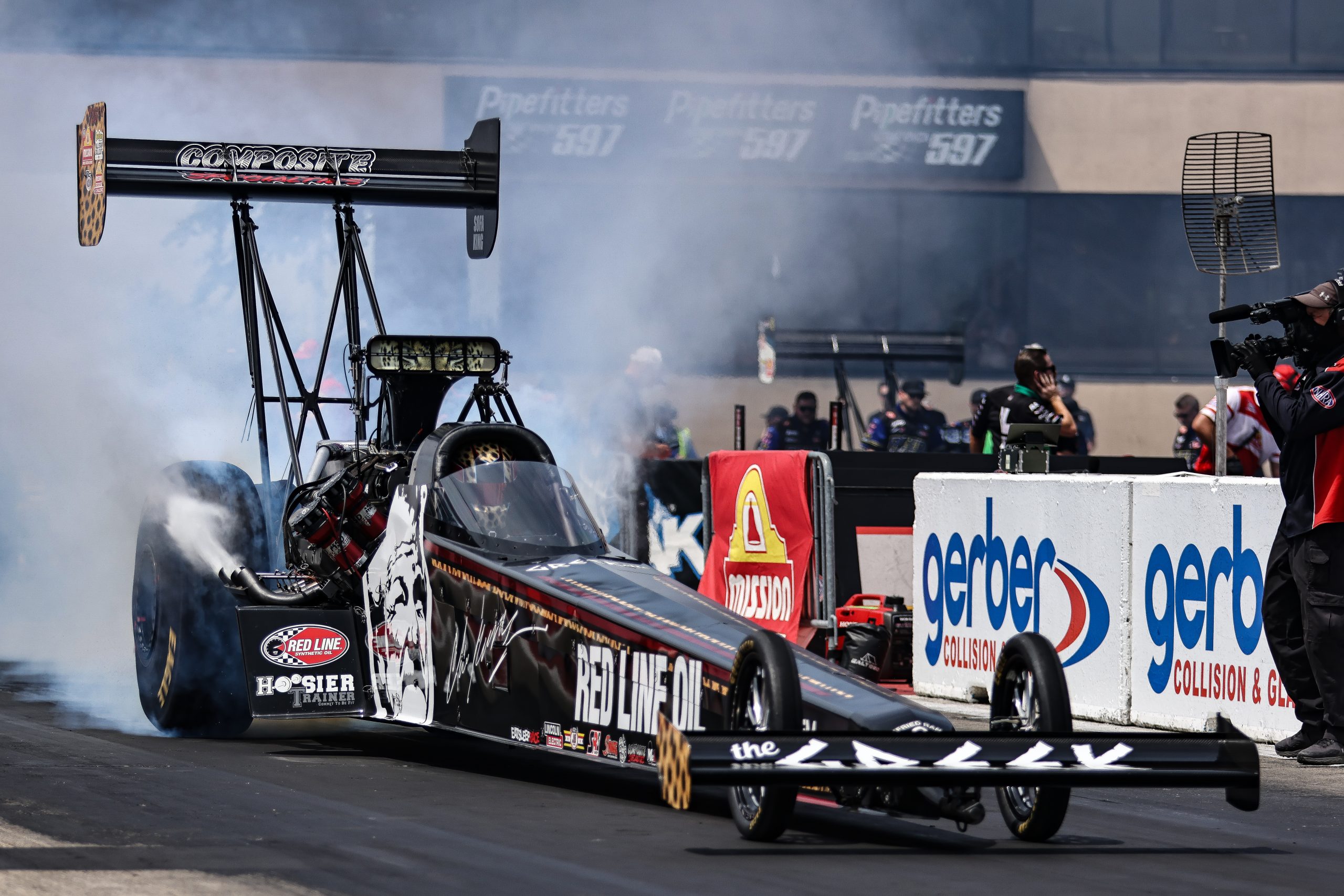 Krista Baldwin's Top Fuel Dragster honored her grandfather Chris Karamesines, with an image of him on the side.