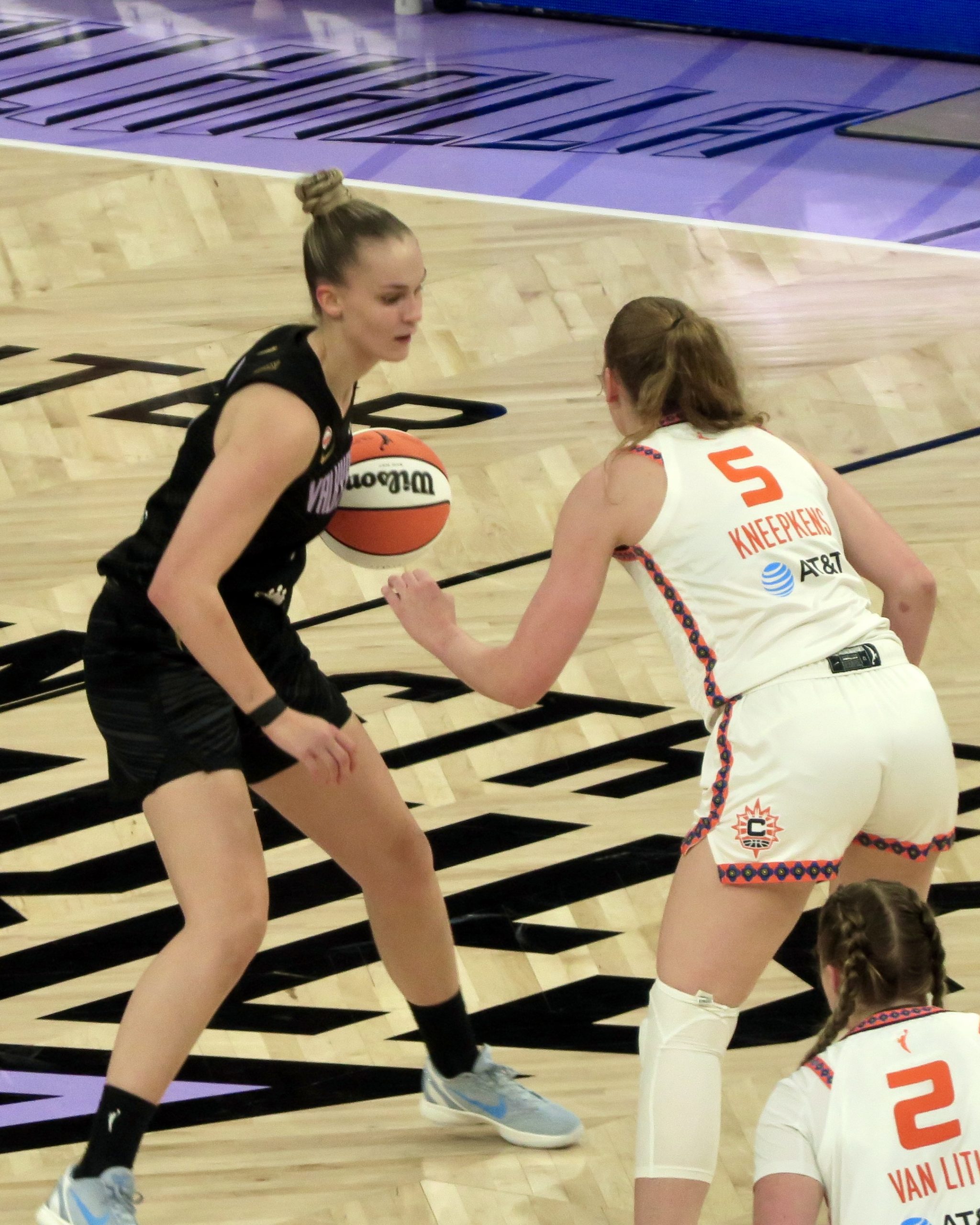 Juste Jocyte handling the ball in the 4th quarter vs the Connecticut Sun with Gianna Kneepkens and Hailey Van Lith showing on defense (Photo | Lucina M)