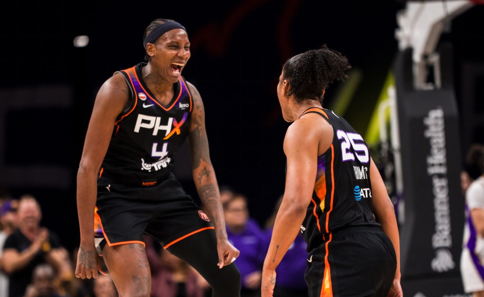 Phoenix Mercury teammates, center Natasha Mack (No. 4) and forward Alyssa Thomas (No. 25) celebrates during a home game against the Los Angeles Sparks on June 13. (Photo- Phoenix Mercury)
