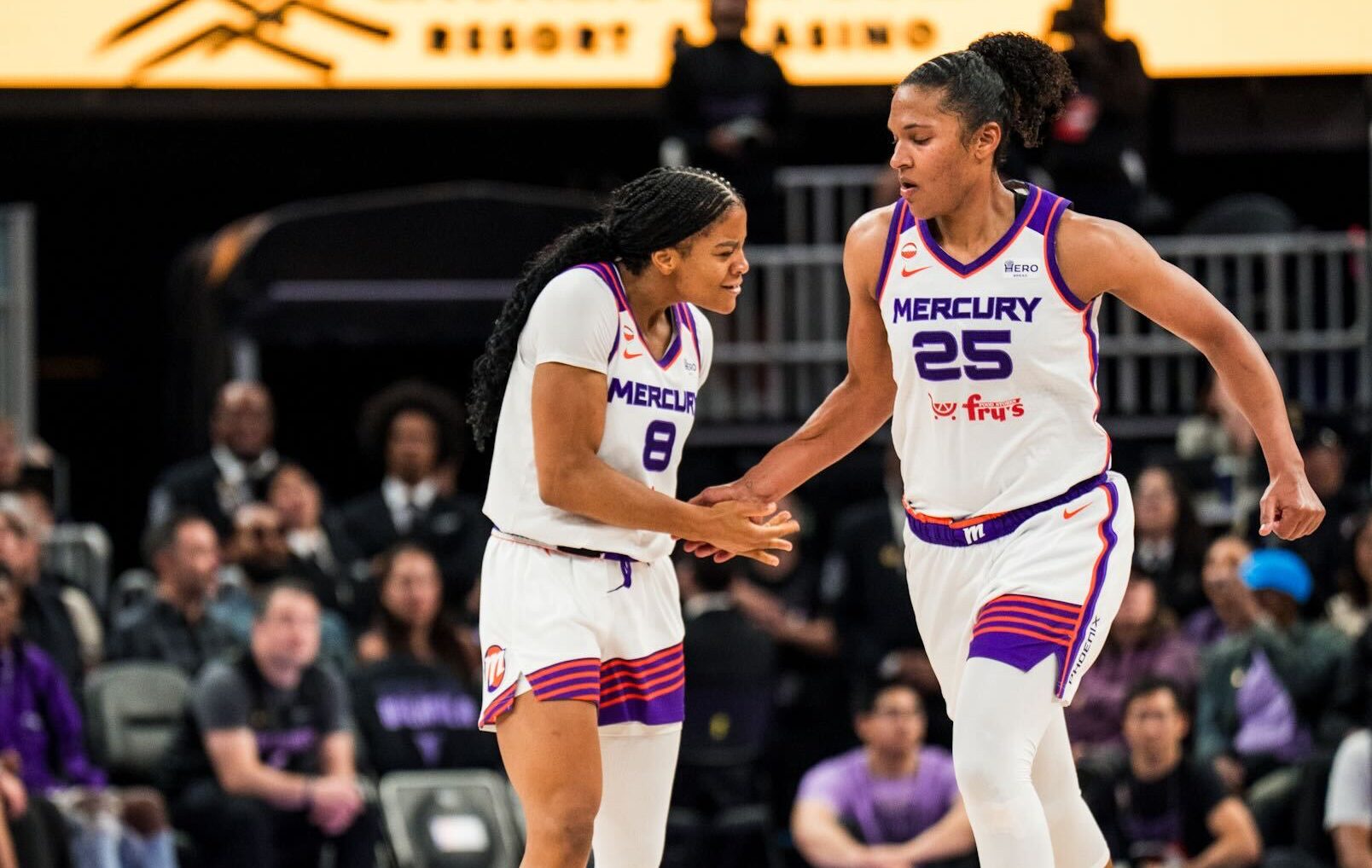 Phoenix Mercury guard Monique Akoa Makani (No. 8) and forward Alyssa Thomas (No. 25) celebrates during game against the Golden State Valkyries on June 9. (Photo- Phoenix Mercury)