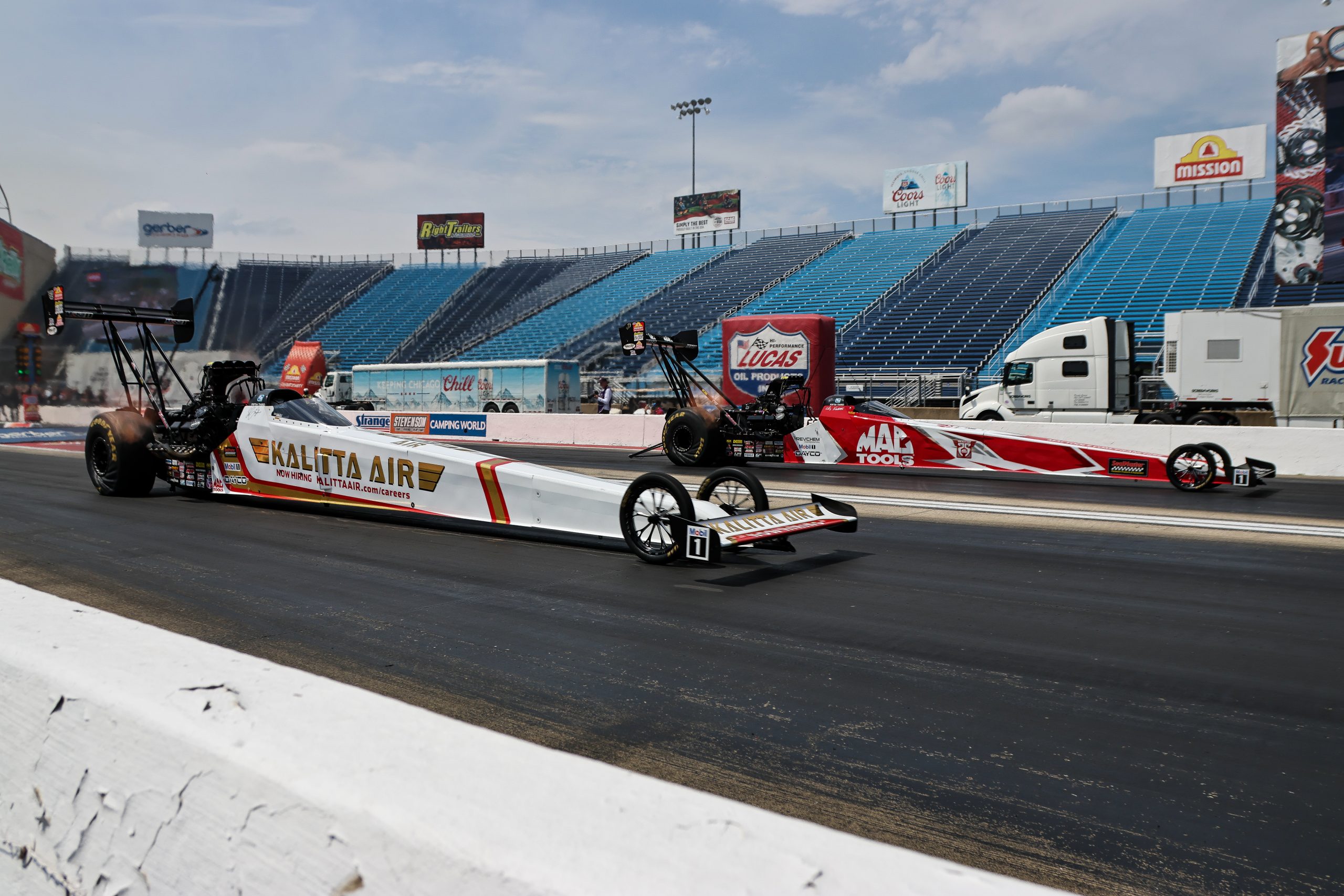 Shawn Langdon and Doug Kalitta line up alongside each other last month in Joliet, Ill.