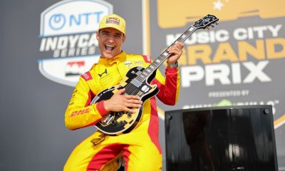 Alex Palou celebrates with the Gibson guitar trophy after claiming his fifth victory of 2026 in the Borchetta Bourbon Music City Grand Prix presented by OnlyBulls at Nashville Speedway (Photo: Chris Owens | Penske Entertainment).